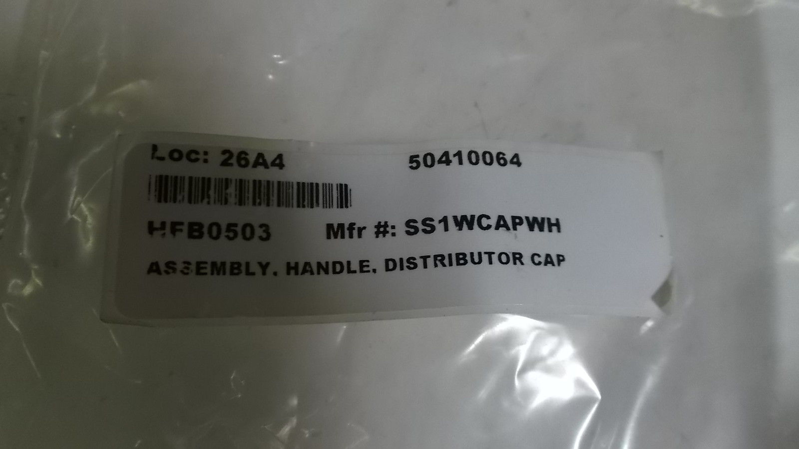 ASSEMBLY, HANDLE DISTRIBUTOR CAP SS1WCAPWH NSNP