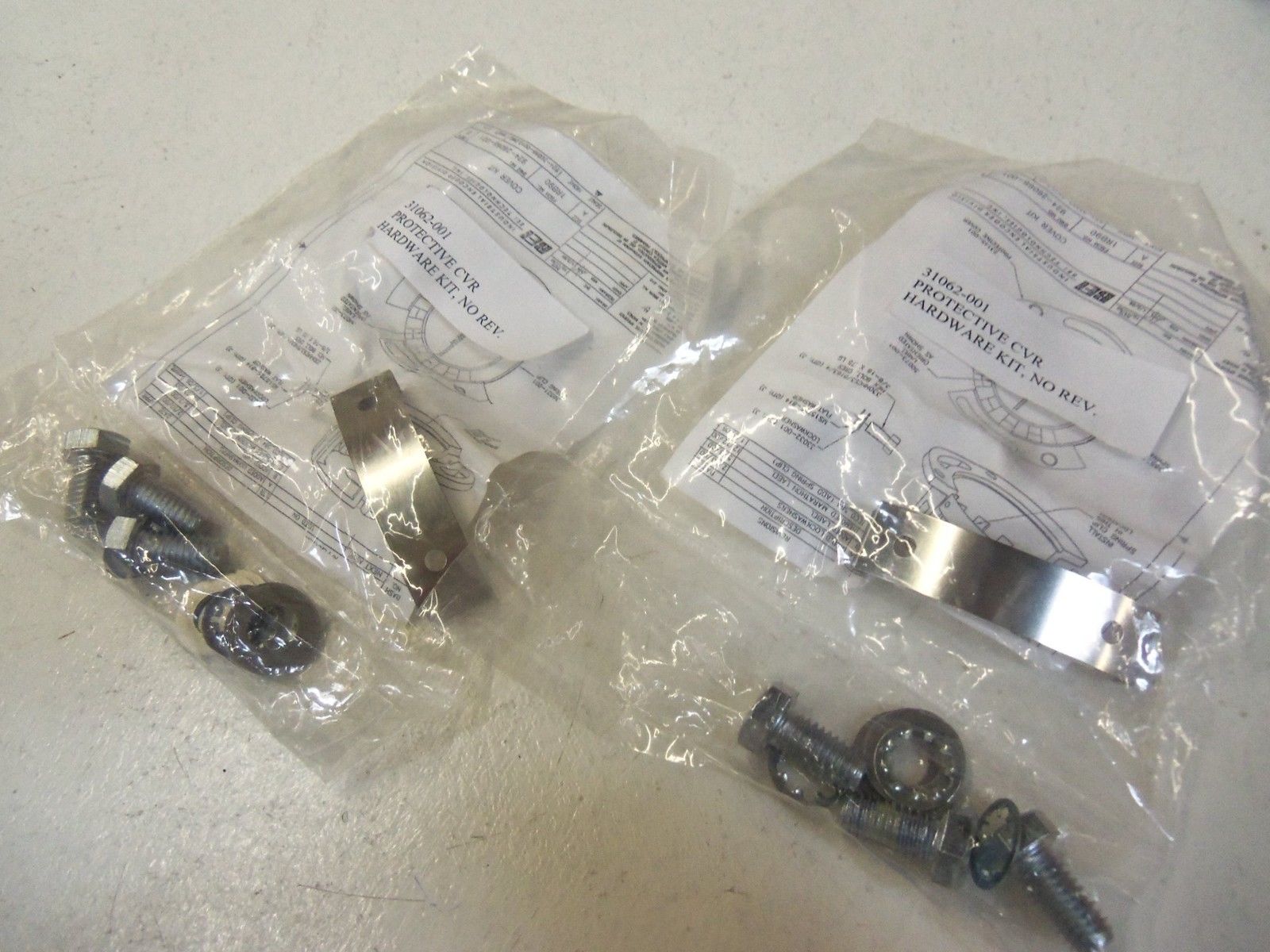LOT OF 2 PROTECTIVE CVR; HARDWARE KIT 31062-001 NSMP
